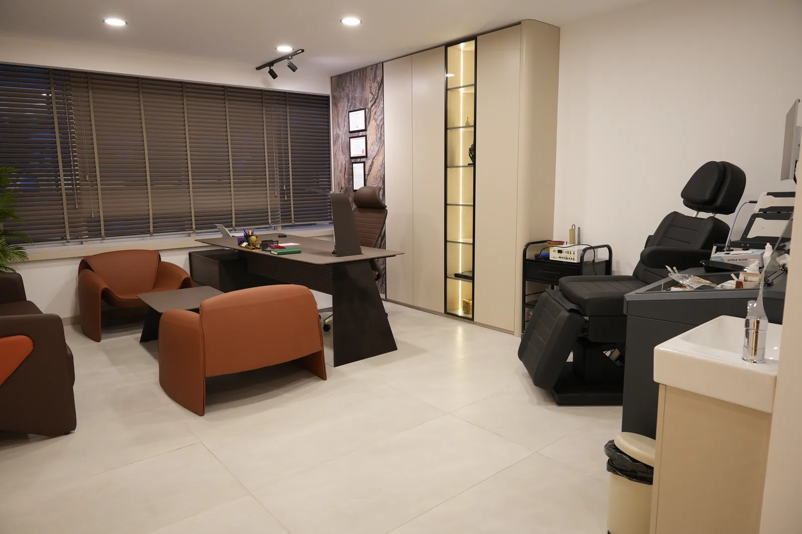 Consultation room with desk, patient seating and an ENT examination unit